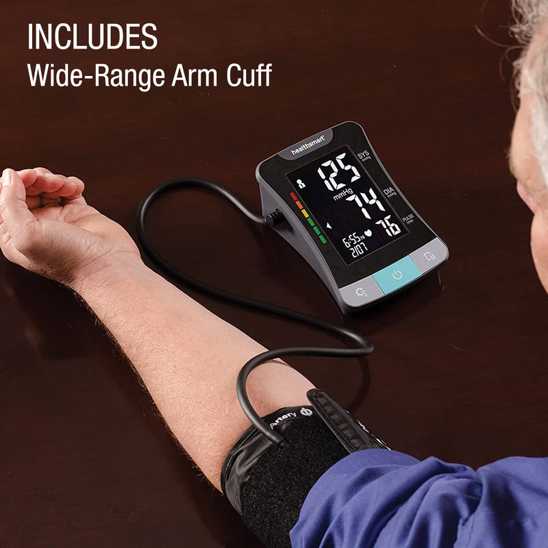 Blood pressure monitor being used on a person's arm with text 'Includes Wide-Range Arm Cuff'.