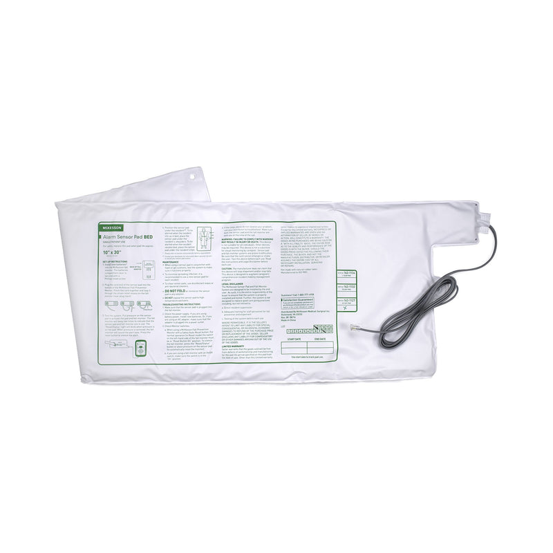 White heating pad with a cable on a white background
