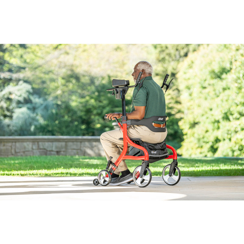 man sitting on the upright rollator by Drive