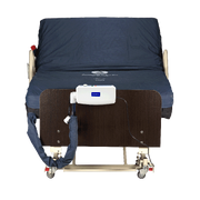 Medical bed with a control panel and straps on a white background