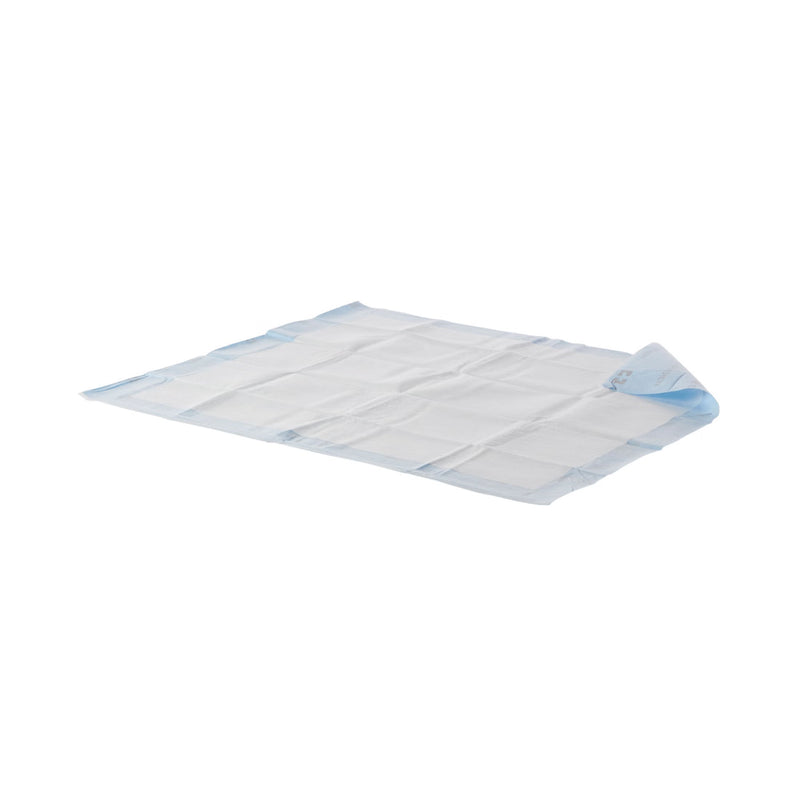Folded blue and white underpad on a white background