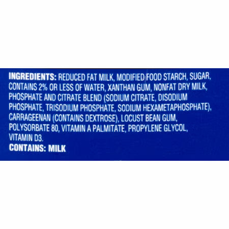 A close-up of a blue label section showing white text with ingredients listed, including reduced fat milk, modified food starch, sugar, xanthan gum, nonfat dry milk, phosphate and citrate blend, carrageenan, locust bean gum, polysorbate 80, vitamin A palmitate, propylene glycol, and vitamin D3. Below the ingredients, it states 'CONTAINS: MILK'.