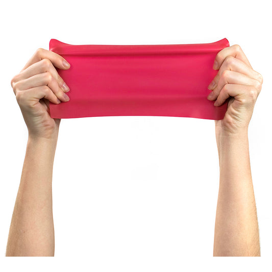 Red resistance band held by hands on a white background
