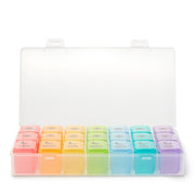 Set of colorful pill boxes in a clear plastic case on a white background