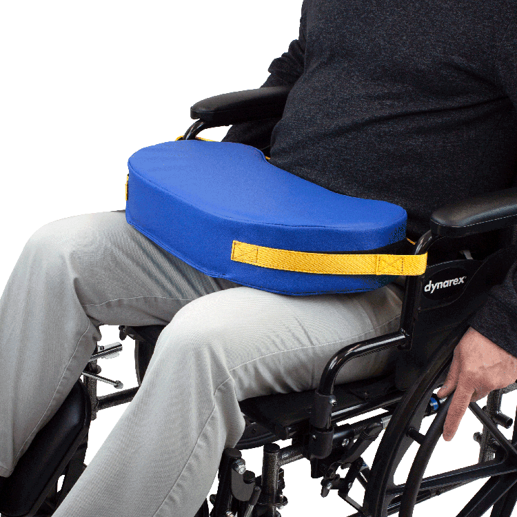 Person in a wheelchair with a blue cushion and yellow strap, featuring the Dynarex brand.