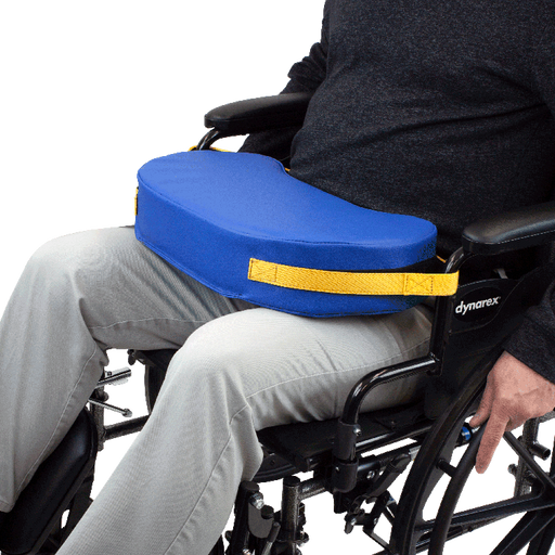 Person in a wheelchair with a blue cushion and yellow strap, featuring the Dynarex brand.