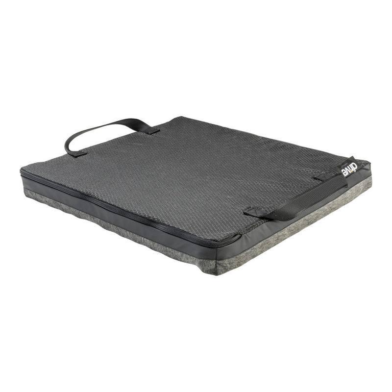 Black and gray mat with a handle on a white background
