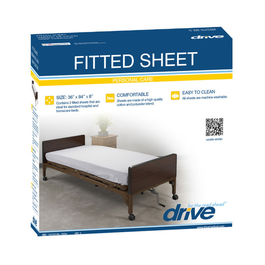 Box of Drive fitted sheet with a bed in the background