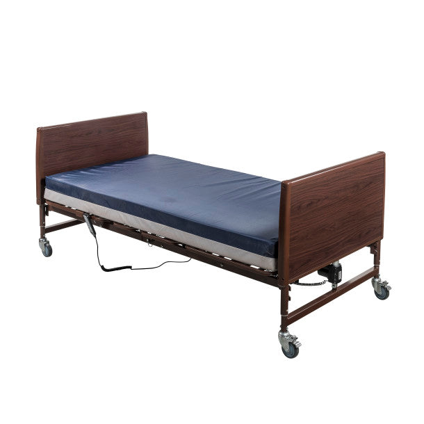 Hospital bed with wooden frame and blue mattress on a white background