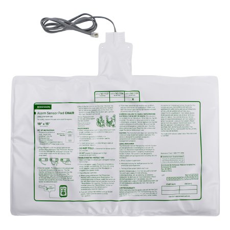 White alarm sensor pad with green text and a power cord on a white background