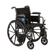 A black manual wheelchair with a black fabric seat and backrest, black metal frame, large spoked rear wheels, and smaller front cast wheels, photographed on a plain white background.