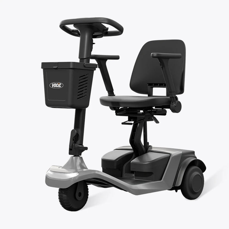 Mobility scooter with a black seat and basket on a white background