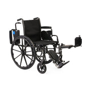 Black manual wheelchair with extended footrest on a white background