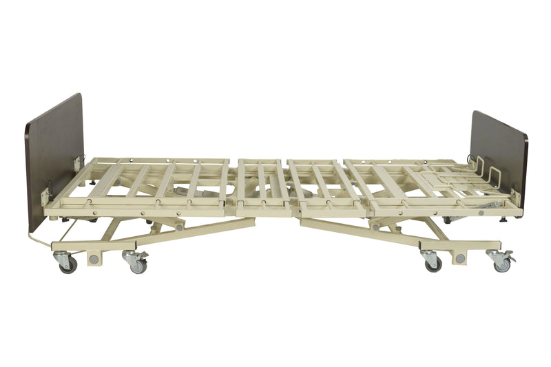 Beige hospital bed frame with metal side rails on a white background