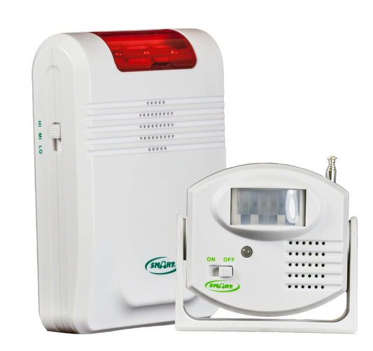 White electronic device with red light and motion sensor on a white background