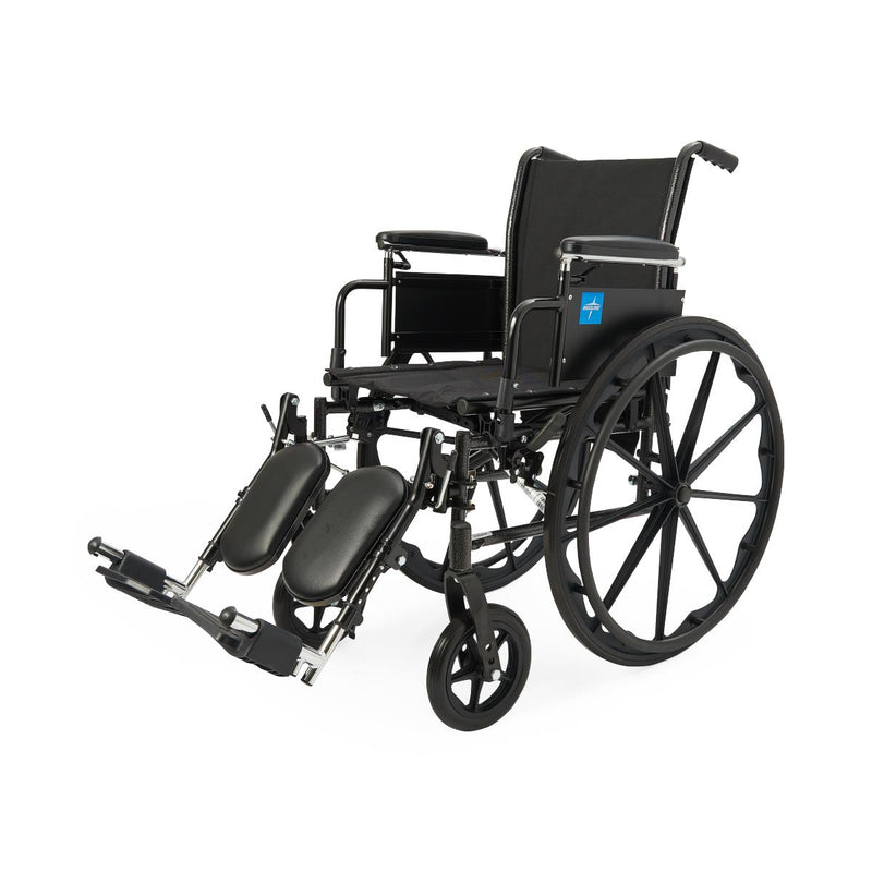 A black manual wheelchair with adjustable footrests and a padded black seat and backrest, photographed on a clean white background.