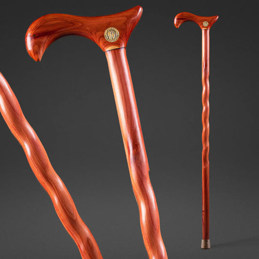 Wooden walking cane with decorative handle on a dark background