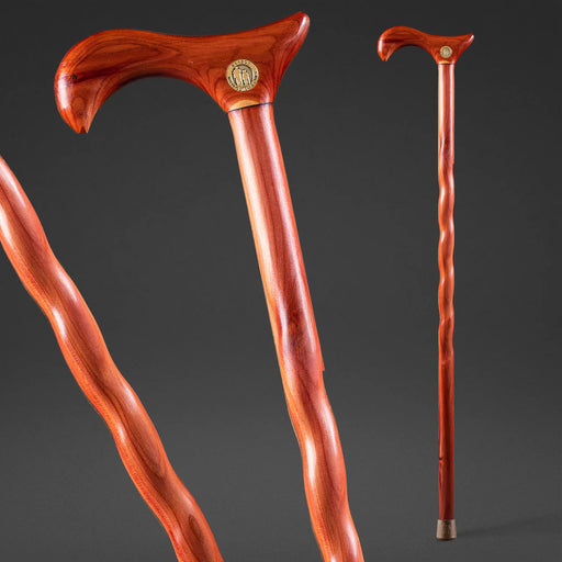 Wooden walking cane with decorative handle on a dark background