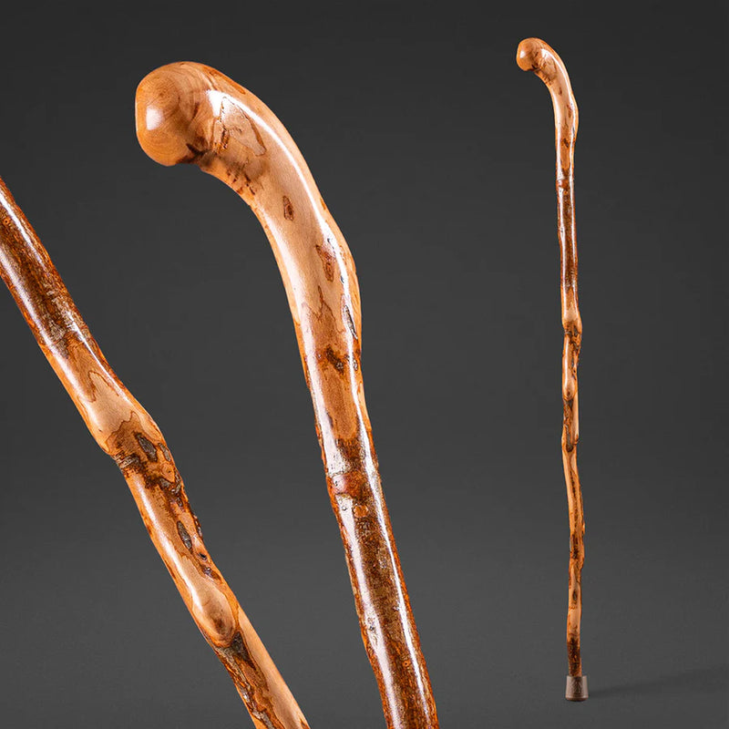 Two wooden canes on a dark gray background