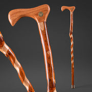 Two wooden walking canes on a dark background