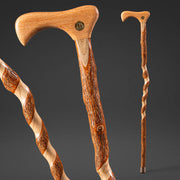 Wooden walking cane with a decorative handle on a dark background