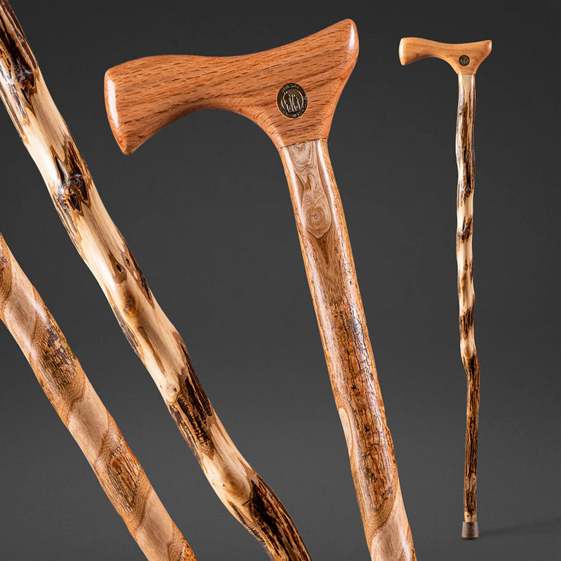 Wooden walking canes with a focus on craftsmanship on a dark background