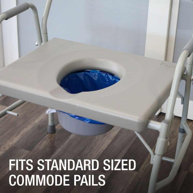 A beige plastic seat tray with a circular opening, shown mounted on a white metal commode frame over a gray bucket with a blue liner. The image is set on a dark wood floor with a text overlay at the bottom reading 'FITS STANDARD SIZED COMMODE PAILS'.