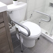 Bathroom setup with a toilet and grab bars for safety