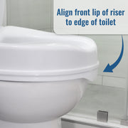 Close-up of a white toilet with a raised rim insert, shown in a bathroom setting with overlaid text reading 'Align front lip of riser to edge of toilet' and a blue arrow indicating placement.