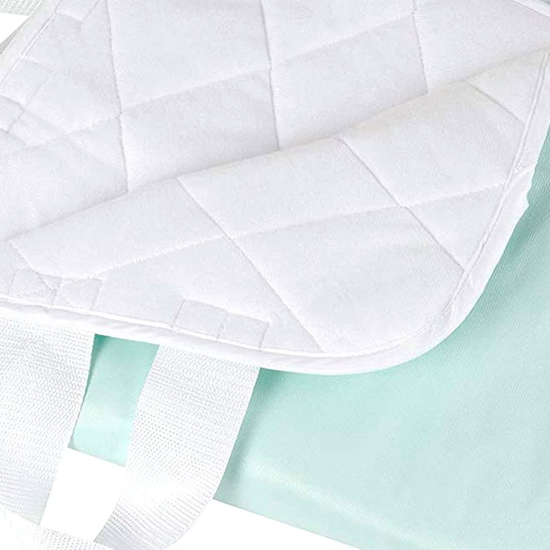 White quilted cover on a light green fabric background