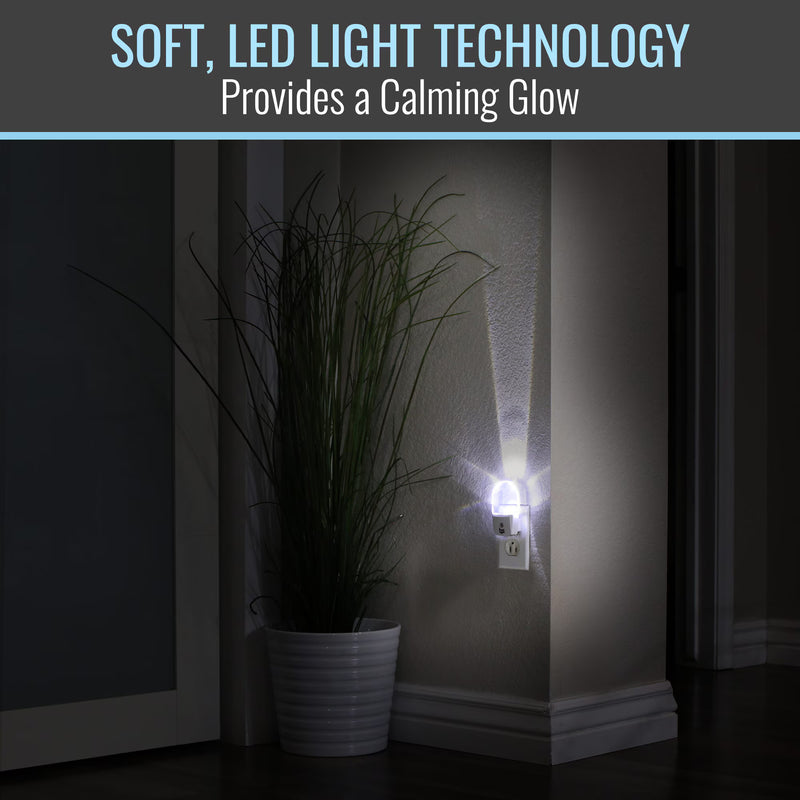 Wall-mounted night light emitting a calming glow next to a plant in a dark room.