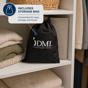 A black drawstring storage bag with a white DMI logo sits on a white shelf next to folded beige and green textiles. A blue callout bubble says the bag includes storage bag and notes it is convenient for easy storage and travel.