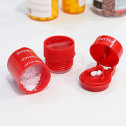 Red pill containers with various compartments on a white background
