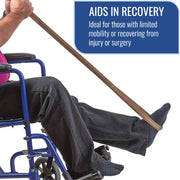 A person seated in a wheelchair uses a brown leg extension strap to assist with foot mobility. The image includes a blue text box that reads 'AIDS IN RECOVERY' and 'Ideal for those with limited mobility or recovering from injury or surgery.