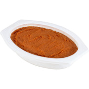 Pumpkin puree in a white container on a white background