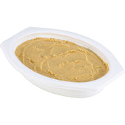 A white plastic oval container filled with smooth beige food, photographed on a plain white background.