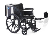 Black wheelchair with armrests and footrests on a white background