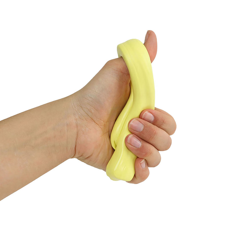 Hand holding a yellow stress ball against a white background