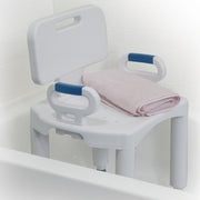 White bath seat with blue handles and a pink towel on a white background