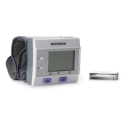 McKesson blood pressure monitor with a battery on a white background