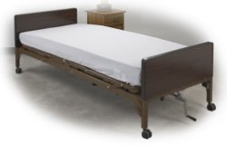 Wooden hospital bed with a mattress on a white background