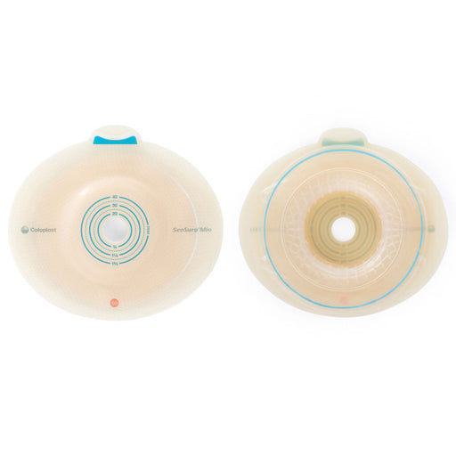 Two circular transparent medical adhesive devices shown side by side on a white background, one labeled 'CooperCare' and the other 'SanteSkin Mini'.