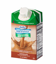 An 8 fl oz carton of Hornel Thick & Easy Chocolate Thickened Dairy Beverage, featuring a green and brown design with a chocolate splash graphic and a white flip-top cap, shown on a white background.