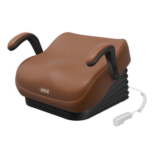 A VOGIC chair lift with a brown faux-leather cushion, black adjustable armrests, a black ribbed base, and a white wired remote control, shown on a solid white background.