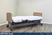 Ergonomic bed with adjustable headboard in a room setting, featuring 'Rift Oak Gray' finish.