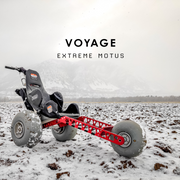 Off-road vehicle with 'Voyage Extreme Motus' branding on a snowy landscape