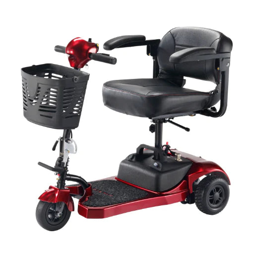 Red and black mobility scooter with basket on a white background
