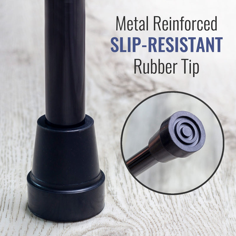 Black cane with slip-resistant rubber tip on a light wood background