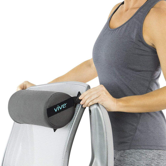 Person using a gray Vive armrest pillow on a chair