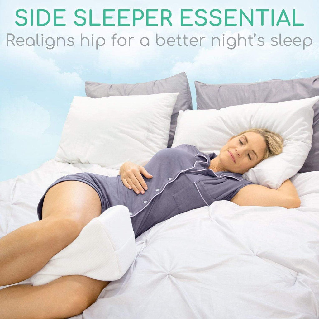 Woman sleeping on a bed with pillows and blanket, promoting a side sleeper essential product.